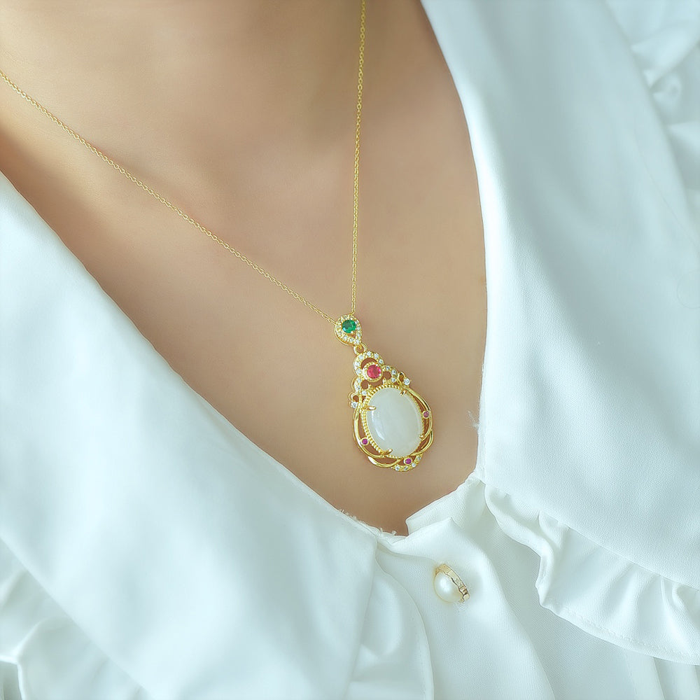 Hetian jade gold openwork teardrop-shaped necklace – rich layers of milky white Hetian jade, rubies, and emeralds, exuding a royal aura.