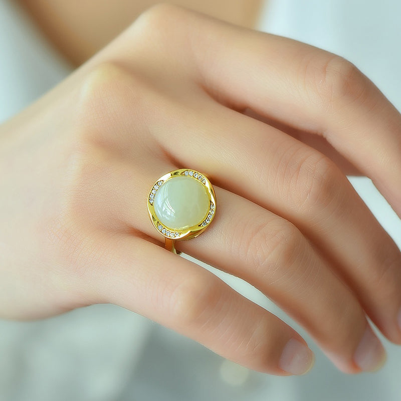 Hetian jade round cabochon ring with gold twisted setting – Hetian jade is warm, elegant, simple, and sophisticated, suitable for everyday wear