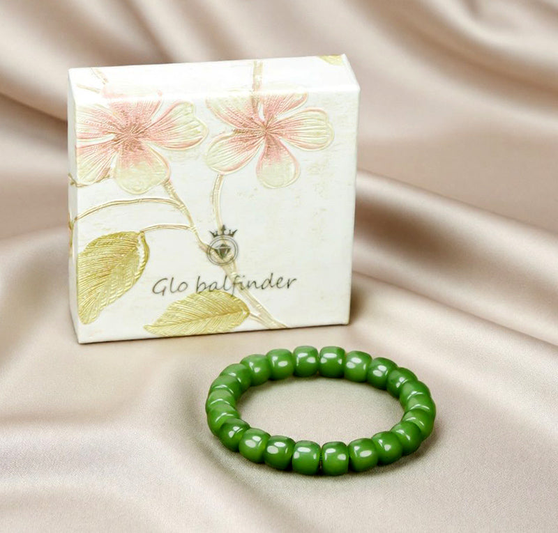 Olive green nephrite barrel bead elastic bracelet – bright and even color with a vibrant cat's-eye luster Green symbolizes vitality, health, and good fortune