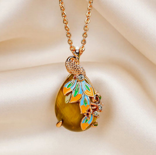 Natural tiger's eye, teardrop shape, enamel peacock, rose gold necklace, embellished with zircon, luxurious and elegant.