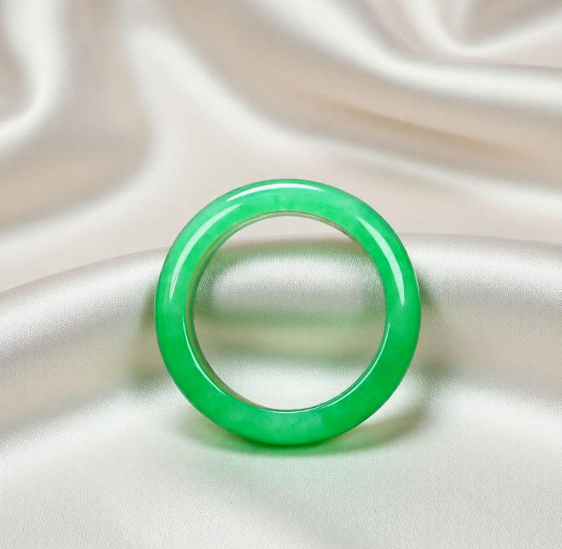 Natural emerald green jadeite plain band ring. Pure natural jadeite, polished into a round band with bright and translucent color.