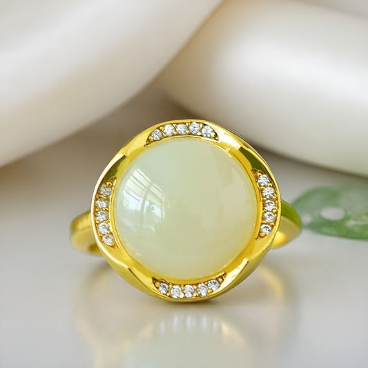 Hetian jade round cabochon ring with gold twisted setting – Hetian jade is warm, elegant, simple, and sophisticated, suitable for everyday wear