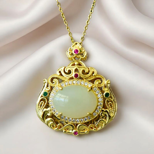 18K Gold Necklace Featuring a Hetian Jade Pendant Set in an Openwork Frame with Auspicious Cloud and Scroll Patterns, Accented with Rubies