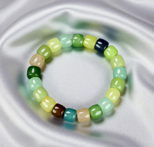 Colorful Jade Barrel Bead Elastic Bracelet - Harmonious mix of yellow, green, mint, emerald green, lake blue, deep blue, milky white, and brown, fresh and elegant.
