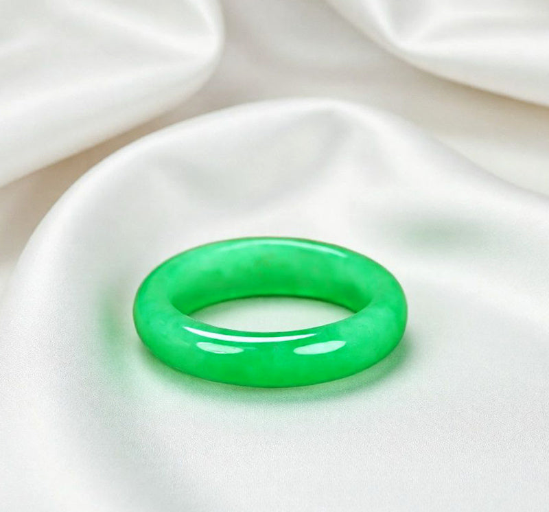 Natural emerald green jadeite plain band ring. Pure natural jadeite, polished into a round band with bright and translucent color.