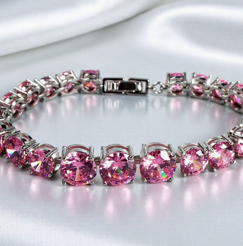 Pink round gemstone tennis bracelet, full row of cut gemstones, four-prong silver base, romantic and sweet.