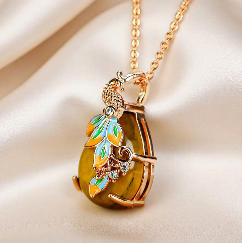 Natural tiger's eye, teardrop shape, enamel peacock, rose gold necklace, embellished with zircon, luxurious and elegant.