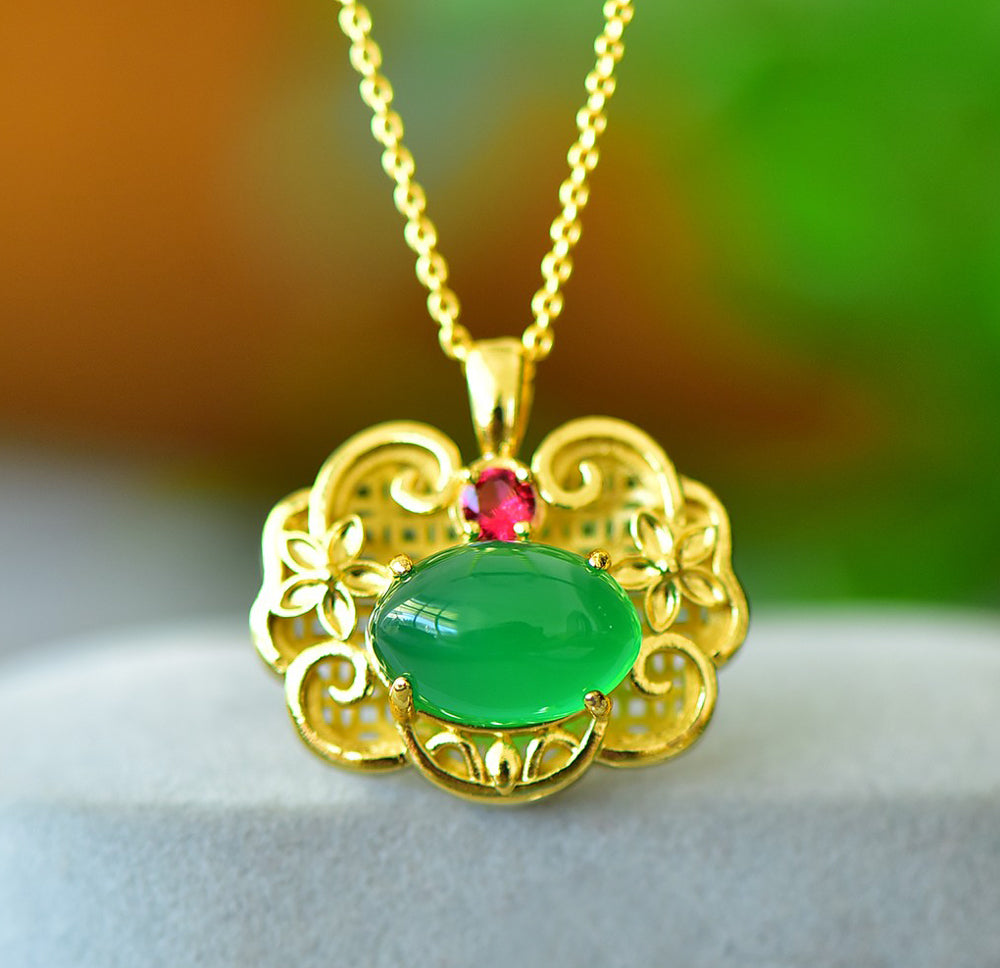 A Green Jade Necklace with Auspicious Cloud Mirror Design – Framed with Golden Auspicious Clouds and Adorned with Rubies