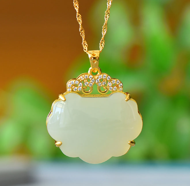Hetian jade pendant necklace with gold auspicious cloud inlay – Hetian jade is warm, elegant, and symbolizes good fortune and wealth.  Comes with a beautiful gift box