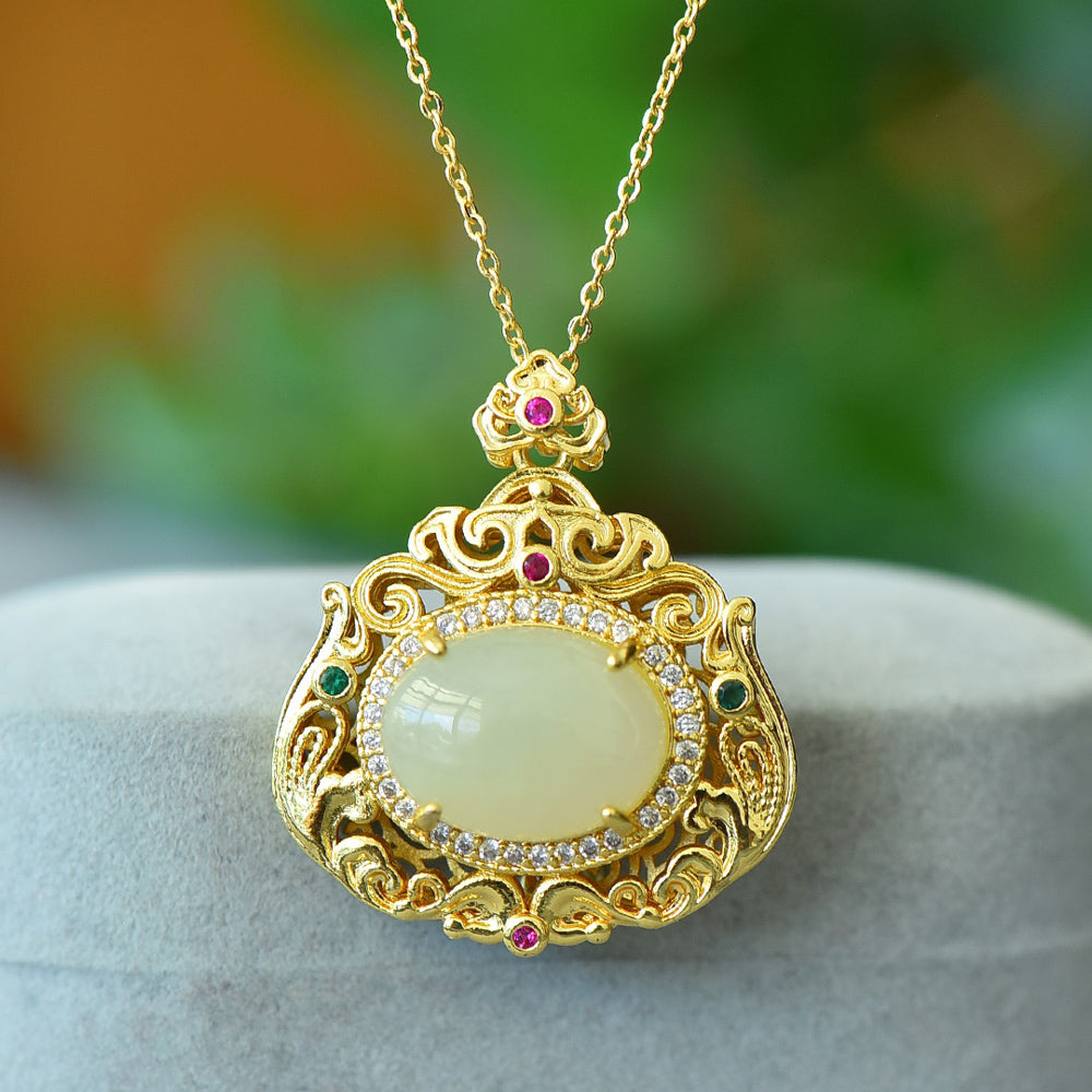 18K Gold Necklace Featuring a Hetian Jade Pendant Set in an Openwork Frame with Auspicious Cloud and Scroll Patterns, Accented with Rubies