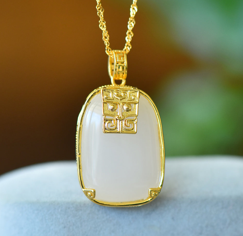 Hetian jade square gold-plated fretwork pendant necklace – with fine gold trim, featuring a classic, warm, and elegant Chinese style.
