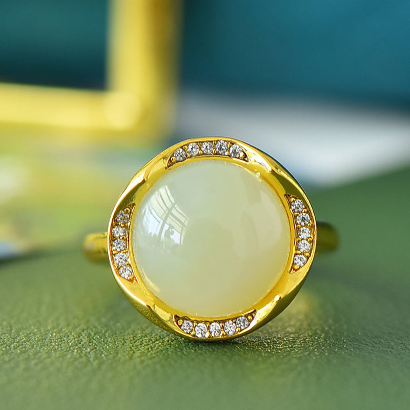 Hetian jade round cabochon ring with gold twisted setting – Hetian jade is warm, elegant, simple, and sophisticated, suitable for everyday wear