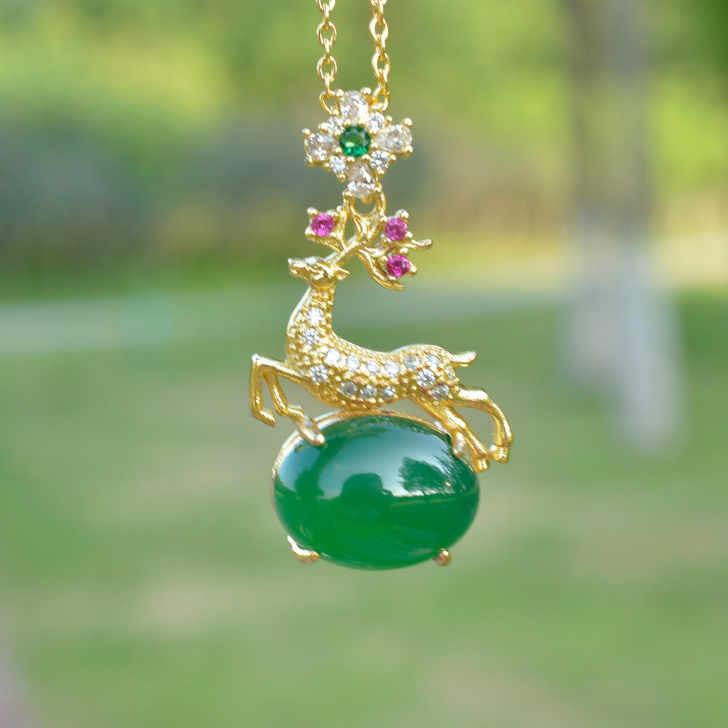 Deer-shaped emerald jade necklace – fully gilded golden deer antlers decorated with red and pink gemstones