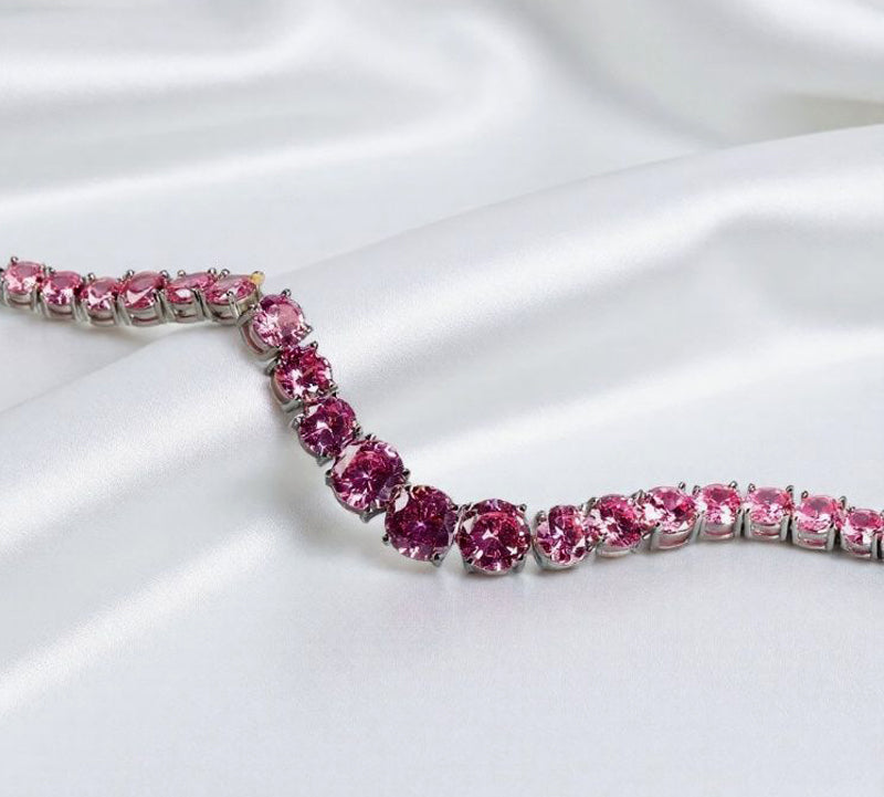 Pink round gemstone tennis bracelet, full row of cut gemstones, four-prong silver base, romantic and sweet.