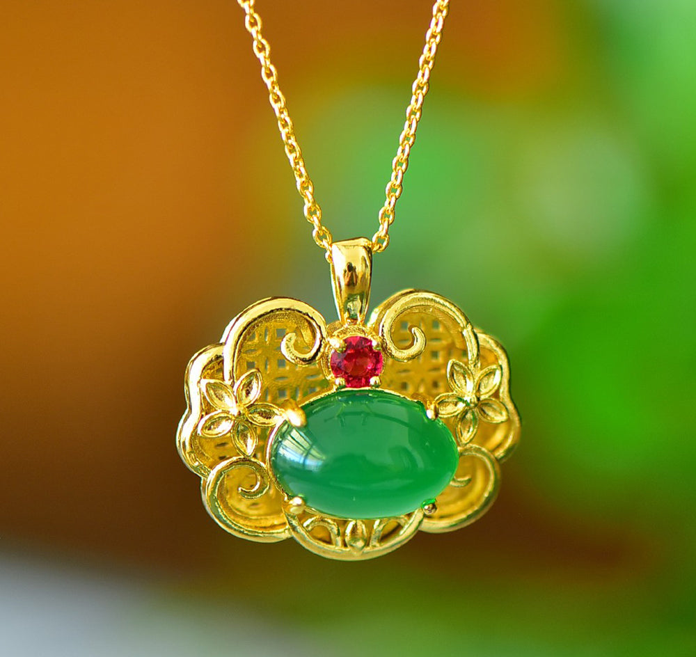 A Green Jade Necklace with Auspicious Cloud Mirror Design – Framed with Golden Auspicious Clouds and Adorned with Rubies