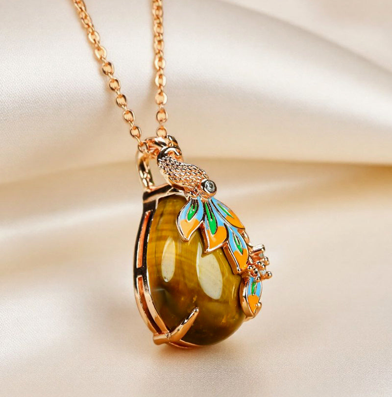 Natural tiger's eye, teardrop shape, enamel peacock, rose gold necklace, embellished with zircon, luxurious and elegant.