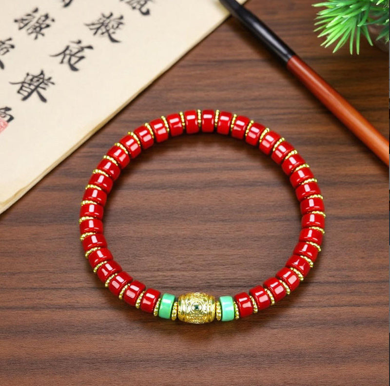 Red coral pill beads, gold serrated spacer bracelet, turquoise,  gold barrel beads, festive and opulent Tibetan style.