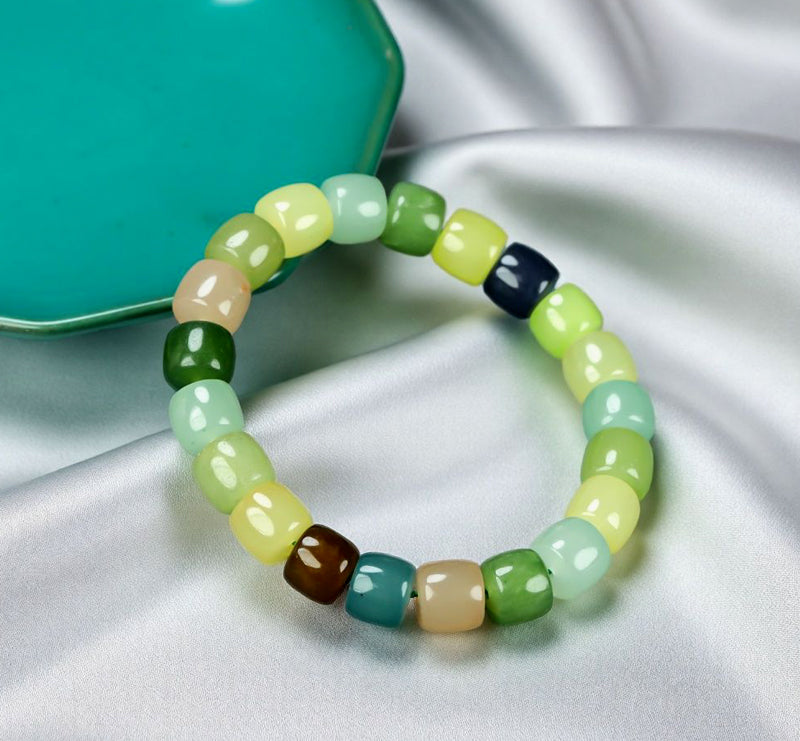 Colorful Jade Barrel Bead Elastic Bracelet - Harmonious mix of yellow, green, mint, emerald green, lake blue, deep blue, milky white, and brown, fresh and elegant.
