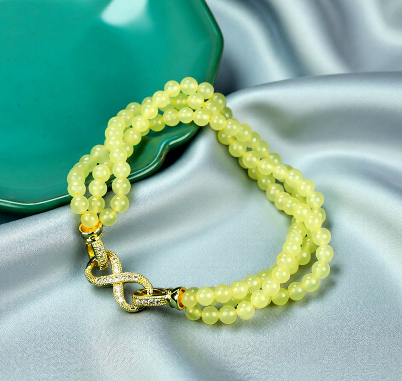 Yellow-green jadeite beaded bracelet with three rows of round beads, gold inlay, multi-bead combination, fresh and gentle.