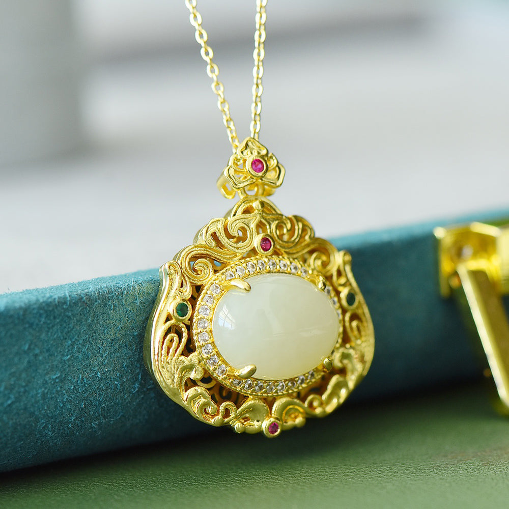 18K Gold Necklace Featuring a Hetian Jade Pendant Set in an Openwork Frame with Auspicious Cloud and Scroll Patterns, Accented with Rubies