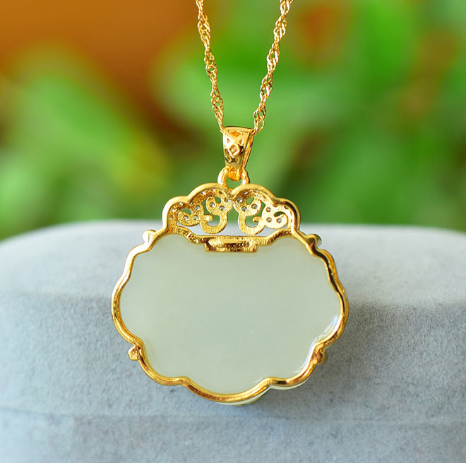 Hetian jade pendant necklace with gold auspicious cloud inlay – Hetian jade is warm, elegant, and symbolizes good fortune and wealth.  Comes with a beautiful gift box