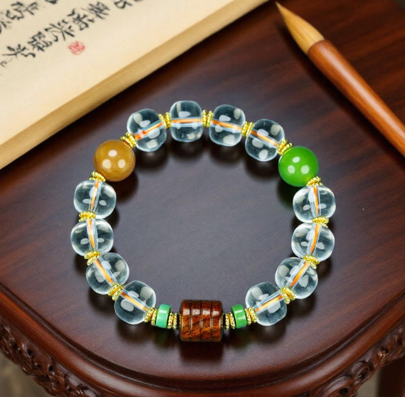 Natural crystal, interspersed wood carvings, and agate beads embellished elastic bracelet – three colors complementing each other, rich in layers