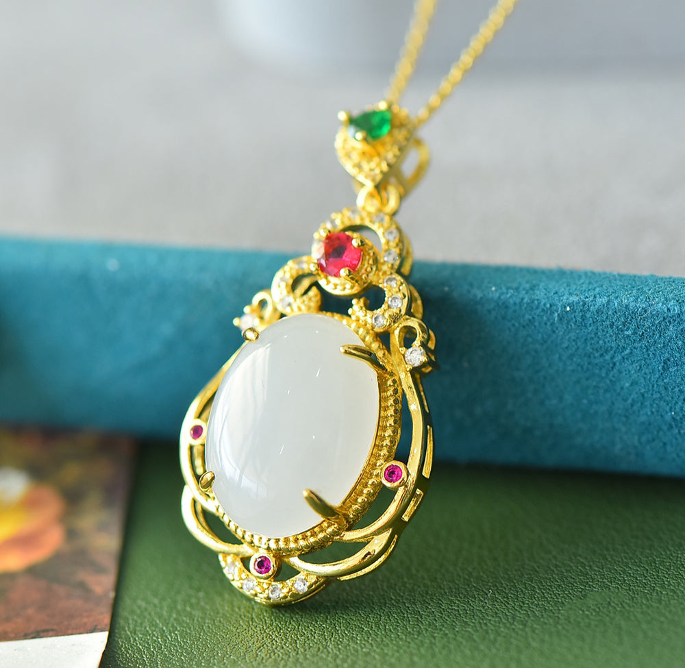 Hetian jade gold openwork teardrop-shaped necklace – rich layers of milky white Hetian jade, rubies, and emeralds, exuding a royal aura.