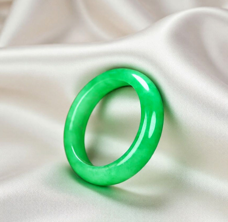 Natural emerald green jadeite plain band ring. Pure natural jadeite, polished into a round band with bright and translucent color.
