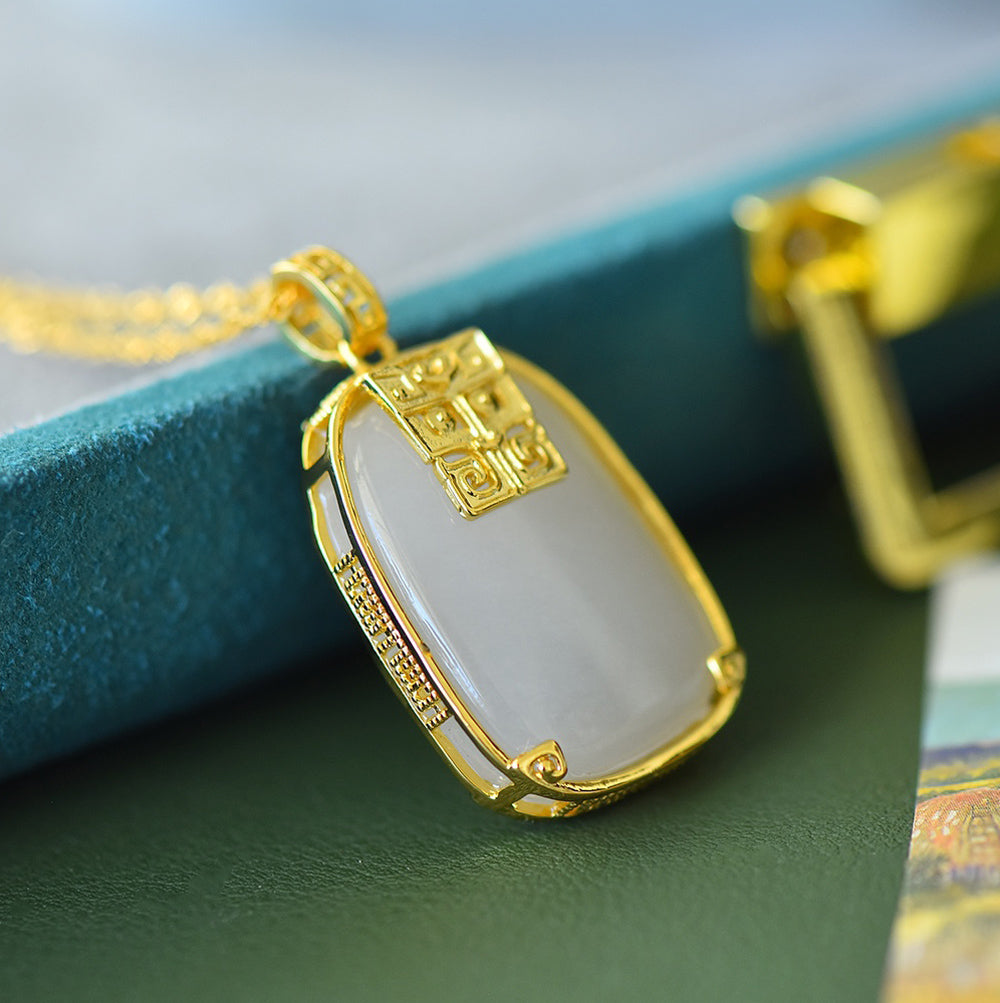 Hetian jade square gold-plated fretwork pendant necklace – with fine gold trim, featuring a classic, warm, and elegant Chinese style.