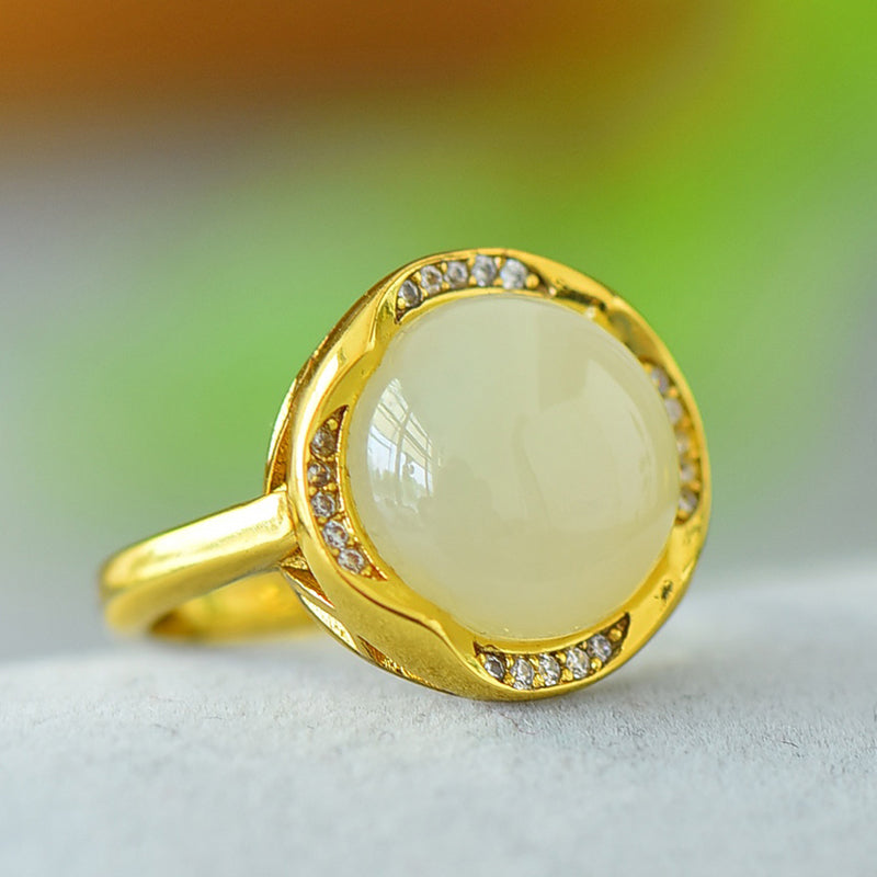 Hetian jade round cabochon ring with gold twisted setting – Hetian jade is warm, elegant, simple, and sophisticated, suitable for everyday wear