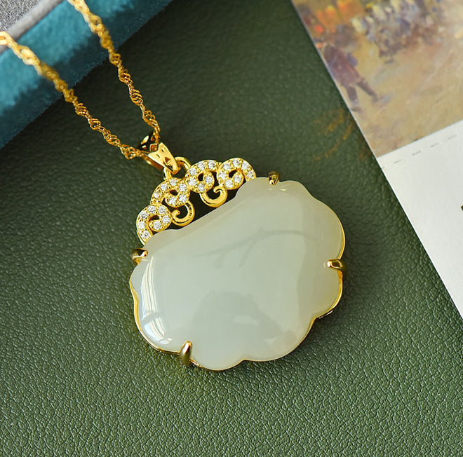 Hetian jade pendant necklace with gold auspicious cloud inlay – Hetian jade is warm, elegant, and symbolizes good fortune and wealth.  Comes with a beautiful gift box
