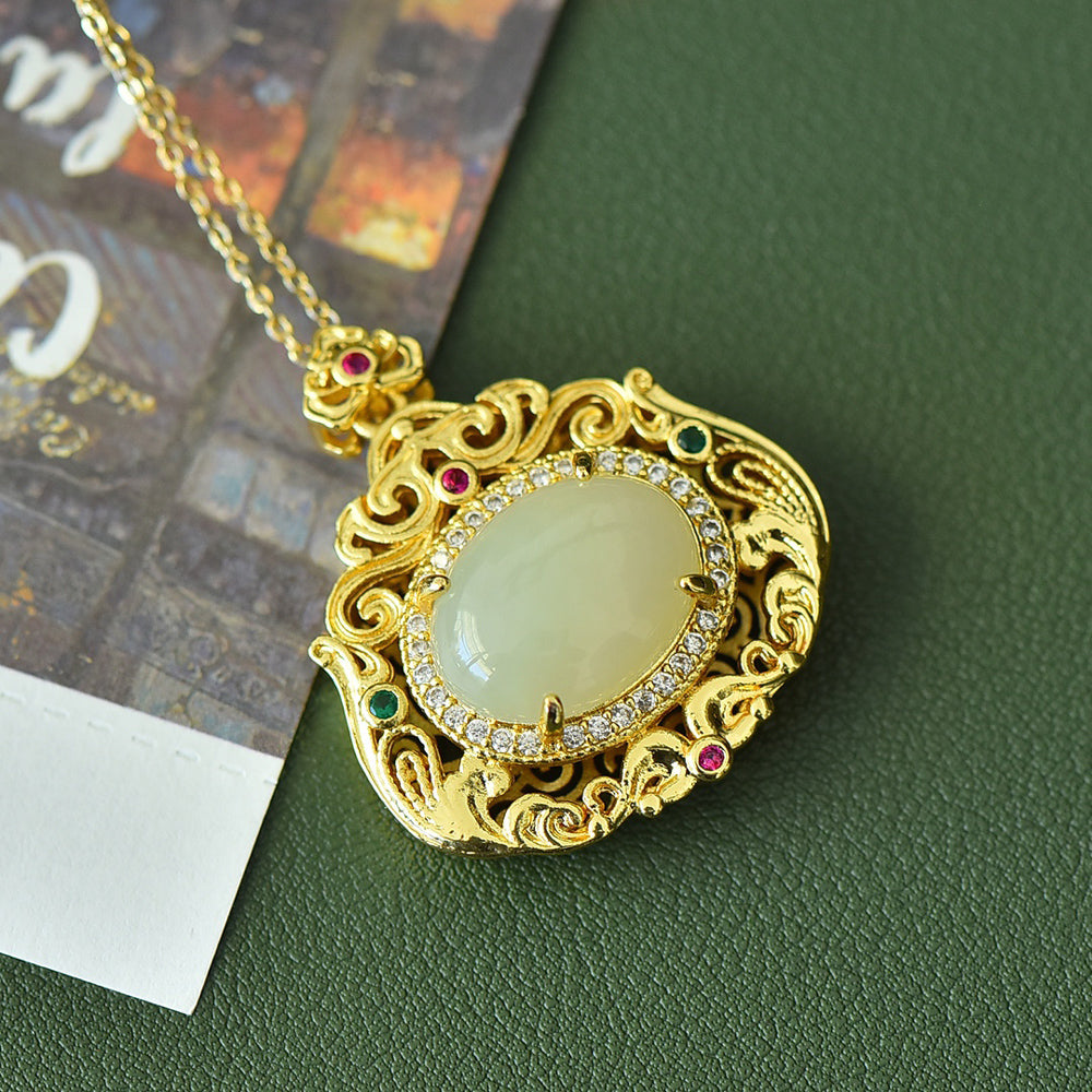 18K Gold Necklace Featuring a Hetian Jade Pendant Set in an Openwork Frame with Auspicious Cloud and Scroll Patterns, Accented with Rubies