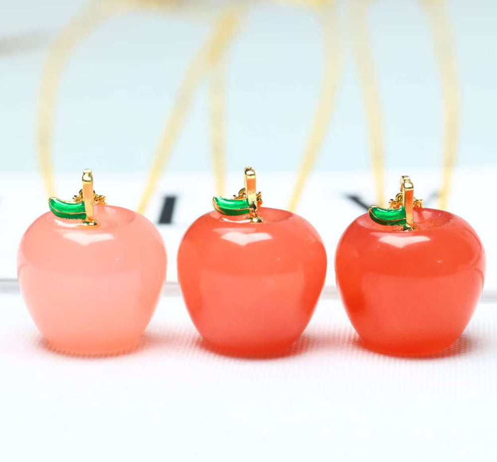 Red Agate Apple Pendant Necklace with Emerald-Green Leaf Clasp – Finely carved apple design symbolizing peace, safety, and a flourishing, vibrant life.
