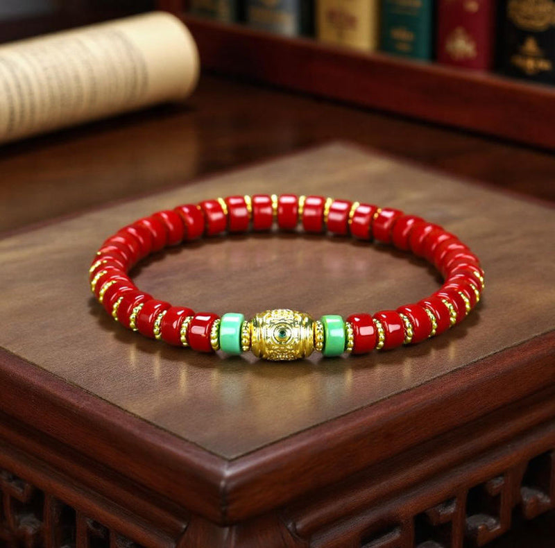 Red coral pill beads, gold serrated spacer bracelet, turquoise,  gold barrel beads, festive and opulent Tibetan style.