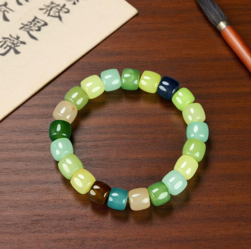 Colorful Jade Barrel Bead Elastic Bracelet - Harmonious mix of yellow, green, mint, emerald green, lake blue, deep blue, milky white, and brown, fresh and elegant.