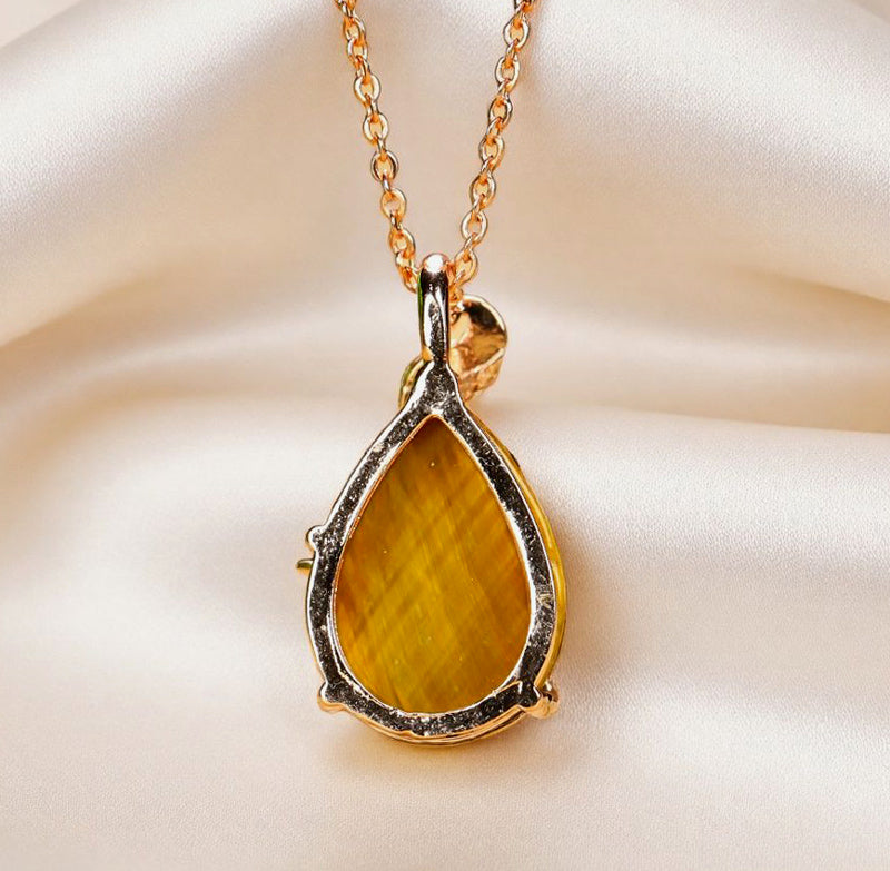 Natural tiger's eye, teardrop shape, enamel peacock, rose gold necklace, embellished with zircon, luxurious and elegant.