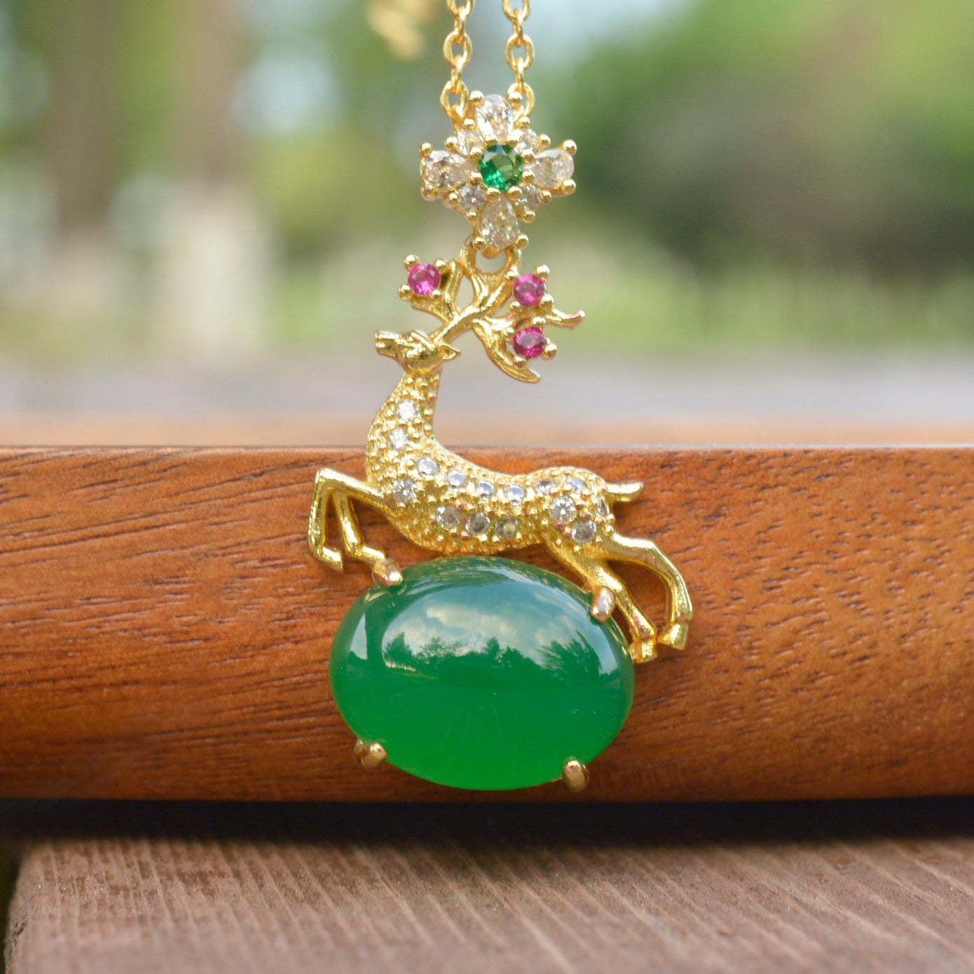 Deer-shaped emerald jade necklace – fully gilded golden deer antlers decorated with red and pink gemstones
