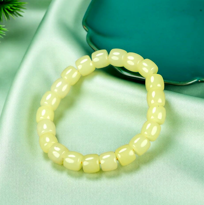 Yellow-green chalcedony barrel bead plain elastic bracelet – fresh and even color, matte and warm texture, simple and pure.