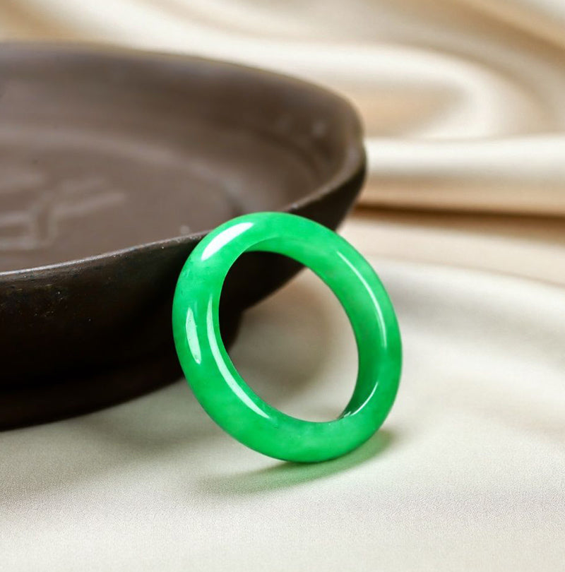 Natural emerald green jadeite plain band ring. Pure natural jadeite, polished into a round band with bright and translucent color.