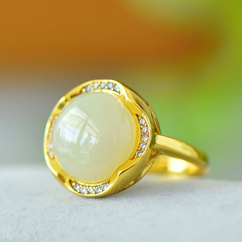 Hetian jade round cabochon ring with gold twisted setting – Hetian jade is warm, elegant, simple, and sophisticated, suitable for everyday wear