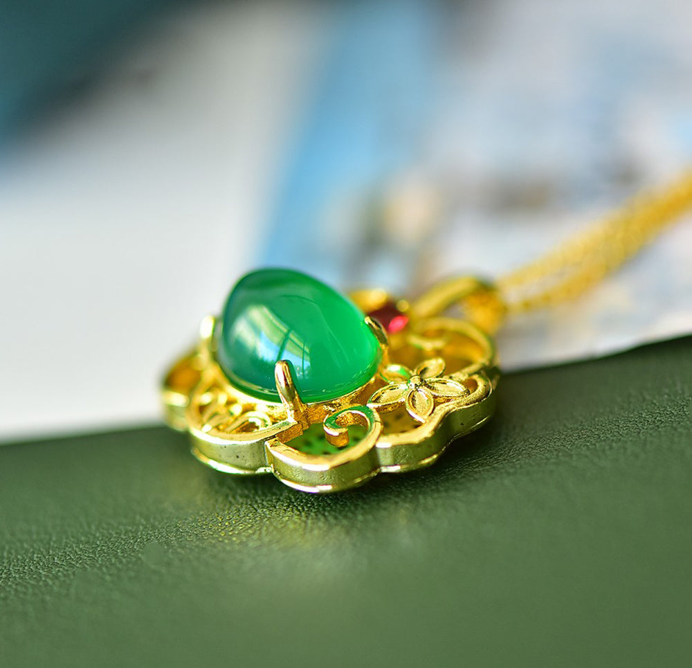 A Green Jade Necklace with Auspicious Cloud Mirror Design – Framed with Golden Auspicious Clouds and Adorned with Rubies