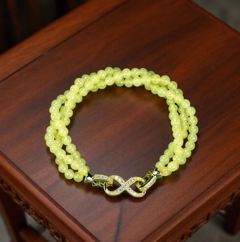 Yellow-green jadeite beaded bracelet with three rows of round beads, gold inlay, multi-bead combination, fresh and gentle.