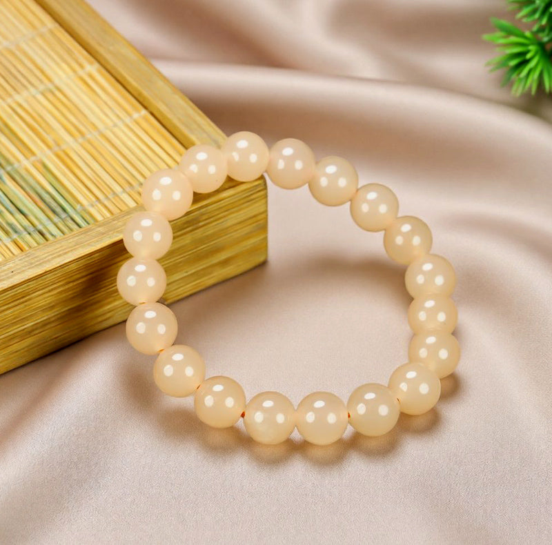 Creamy white chalcedony elastic bracelet with large round beads smooth and lustrous like fine jade, minimalist and pure, exuding elegant sophistication.