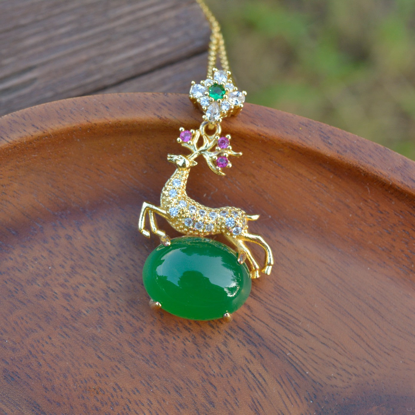 Deer-shaped emerald jade necklace – fully gilded golden deer antlers decorated with red and pink gemstones