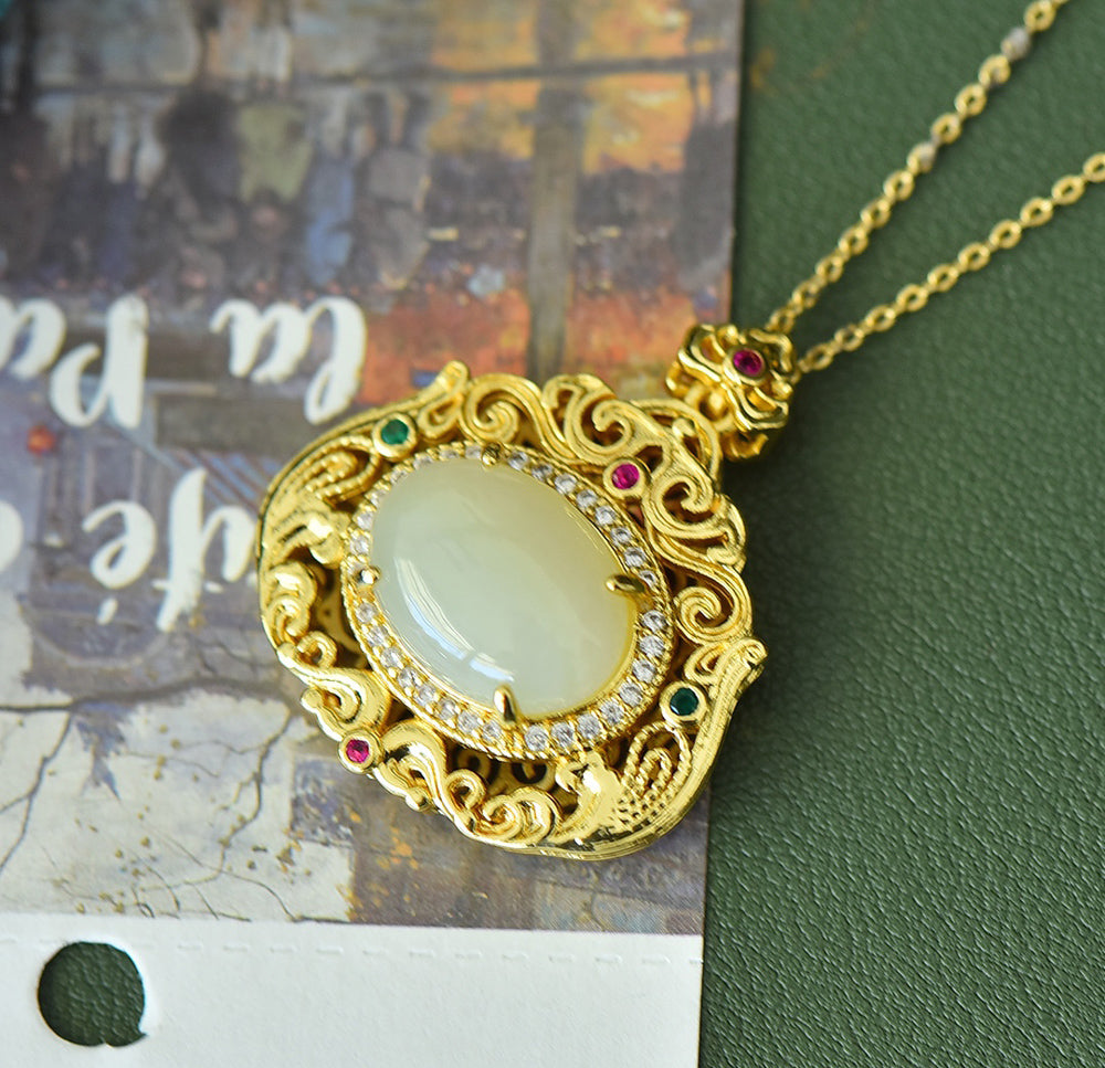 18K Gold Necklace Featuring a Hetian Jade Pendant Set in an Openwork Frame with Auspicious Cloud and Scroll Patterns, Accented with Rubies