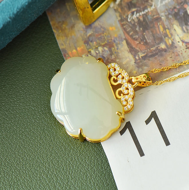 Hetian jade pendant necklace with gold auspicious cloud inlay – Hetian jade is warm, elegant, and symbolizes good fortune and wealth.  Comes with a beautiful gift box