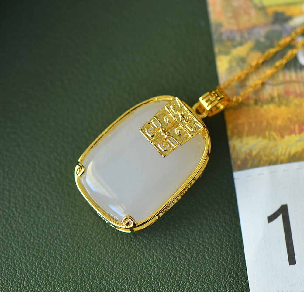 Hetian jade square gold-plated fretwork pendant necklace – with fine gold trim, featuring a classic, warm, and elegant Chinese style.
