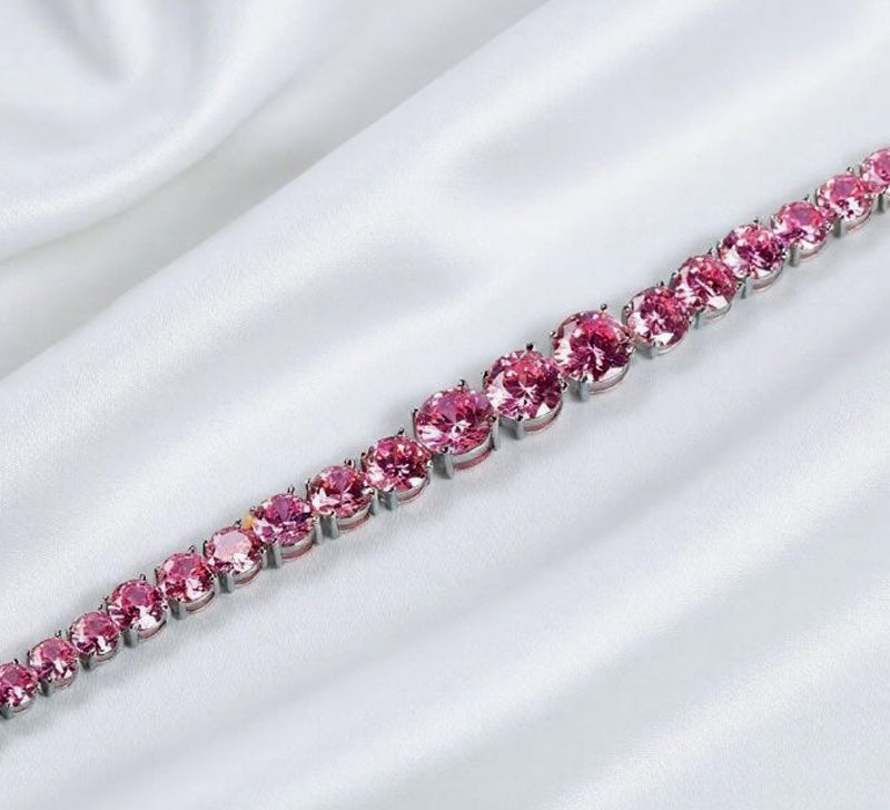 Pink round gemstone tennis bracelet, full row of cut gemstones, four-prong silver base, romantic and sweet.