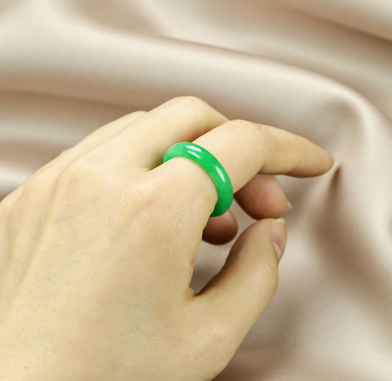 Natural emerald green jadeite plain band ring. Pure natural jadeite, polished into a round band with bright and translucent color.