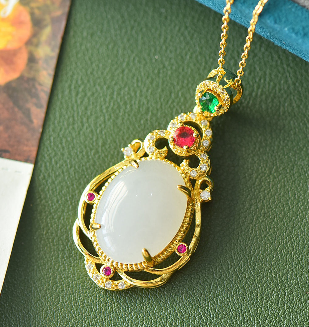 Hetian jade gold openwork teardrop-shaped necklace – rich layers of milky white Hetian jade, rubies, and emeralds, exuding a royal aura.